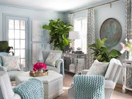 Big pieces of art can help make your small room look bigger by catching your eyes attention right when you enter a room. Small Living Room Ideas Hgtv