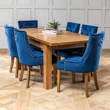 From individual dining chairs to full dining table and chair sets we have a range of styles available from fabric chairs to wooden chairs to suit every dining complement your dining room with an additional oak sideboard all available to match from oak city. Solid Oak Medium Extending Dining Table 6 X Blue Velvet Scoop Chairs The Furniture Market