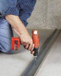 fasten an interior wall to concrete