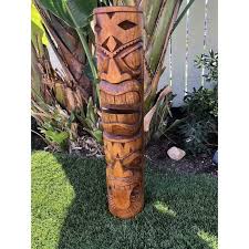 tiki statue tongue style wood carvings
