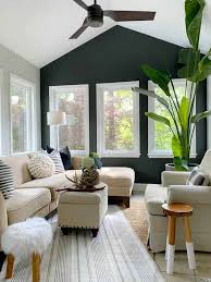 a black accent wall in a living room