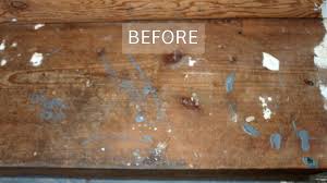 stripping old varnish paint mess from