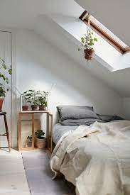 decorate a bedroom with sloped ceiling