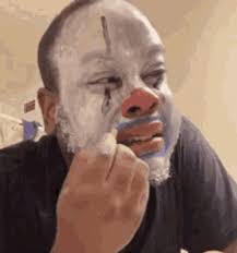 clown makeup putting lipstick mirror