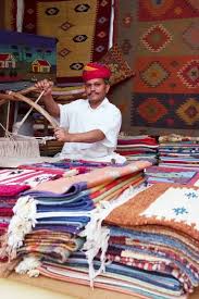 craftsman uses handloom to produce rugs