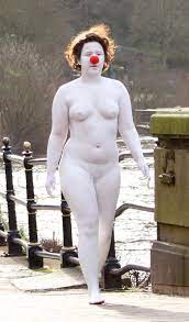Naked female clown covered head-to-toe in white paint and wearing red nose  spotted wandering around city centre as stunned locals look on | The Sun