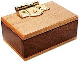 You can only open it if you find its secret opening sequence. Bits And Pieces The Mini Secret Gift Box Brainteaser Puzzle Wooden Maple And Walnut Hinged Money Puzzle Box Doug Engel Brainteaser Amazon Co Uk Toys Games