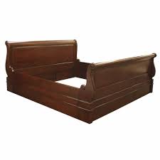 sleigh bed that holds a divan bed