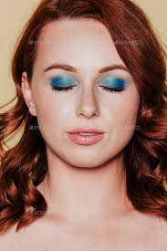 red headed woman wearing 80s makeup