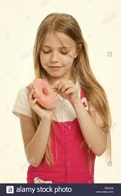 Girl On Smiling Face Holds Sweet Donut In Hand Isolated On