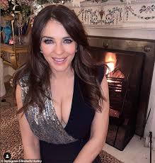 Elizabeth hurley is leaving little to the imagination. Elizabeth Hurley Puts On A Very Busty Display In A Silver Sequin And Black Wrap Dress Duk News