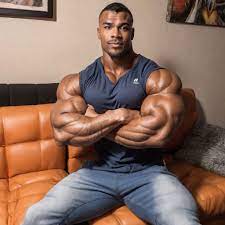 flexing his 240 inches biceps showing