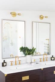 Gold Light Fixtures Above The Double Mirrors Bathroom Lights Above Mirror Modern White Bathroom Bathroom Led Light Fixtures