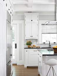 white shaker cabinets with oil rubbed