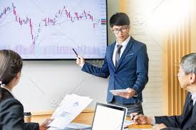 Business Man Speaker Giving A Talk Stock Profit Graph