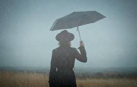 woman walking alone in the rain
