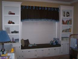 Custom built in cabinets, floating shelves and fireplace mantel. Window Seat And Bookshelves For Nursery Finewoodworking