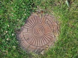 How To Hide Sewer Cover In Yard 6