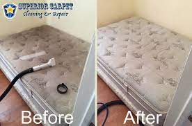 a carpet cleaner on a mattress