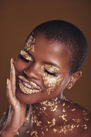 black woman face and gold makeup