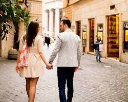 Image of couples wandering through Rome streets, Italy