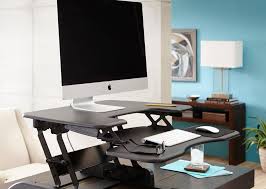 Raise the monitor or laptop screen so that the top of the screen is at your eye level. Standing Desks Benefits And Risks Mcclure Ergonomics