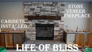 installed stacked stone fireplace