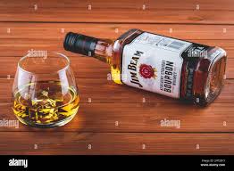 jim beam on a brown wooden table