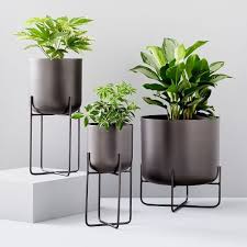 Display all the beauty of your plants and flowers with planters and plant stands. Spun Metal Standing Planters Antique Bronze Planter Stand Planters Indoor Planters