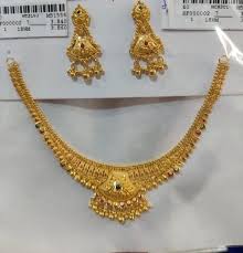 gold collar necklace with long earrings