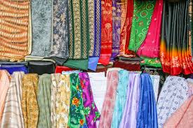 fabrics at dubai textile souk stock