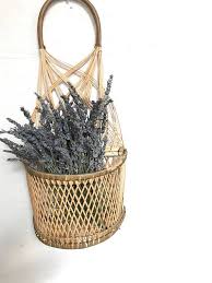 Wicker is a natural and unique material that has been used to make this set features three different sized baskets made from woven wicker. Vintage Woven Rattan Wicker Wall Hanging Basket Planter With Pocket Bohemian Wall Decor Wicker Wall Wall Hanging Basket Wall Hanging Plants