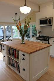 It is slightly wider than would be ideal, but it gives us storage and a place to sit and eat or work. Ikea Kitchen Design Ikea Kitchen Island Kitchen Island Plans