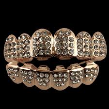 Both 22k and 24k gold jewelry are alluring, elegant and magnify the beauty of the wearer. 24k Rose Gold Grillz Fully Iced Out With Cz Diamonds Gold Grillz Grillz Diamond Grillz