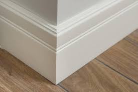 should baseboards touch the floor what