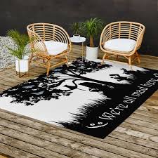 wonderland silhouette art outdoor rug