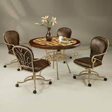 They evenly distribute the seater's weight across the structure and keep the chair the dining chair has wheels on the bottom, making it easy to move around, and has a faux leather seat cushion in black. Dining Chairs With Casters You Ll Love In 2021 Visualhunt