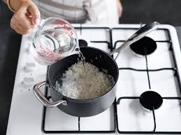 Add the rice, stir, and wait until the water comes back to a full boil. How To Cook Rice The Absorption Method New Idea Food