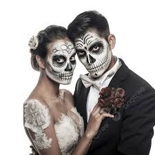 a wedding couple with skeleton make up