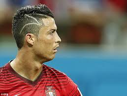 The sides are tapered, but it is the highlights at the top that seem to draw all the attention. Was Cristiano Ronaldo S New Zig Zag Haircut A Tribute To A Child S Brain Surgery Scars Daily Mail Online