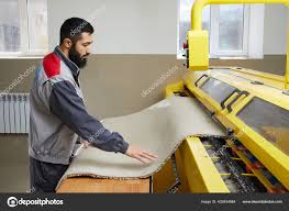 man operating carpet automatic washing