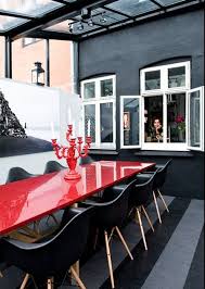 Outdoor Dining With Red Table And Black