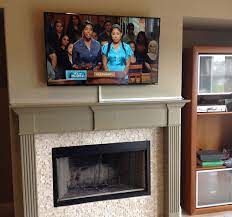 tv wires over a brick fireplace