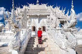 White and gold chinthe are at each corner guarding the chedi. Chiang Rai Temple Tour White Temple Black House Blue Temple And More Book Now Tripguru