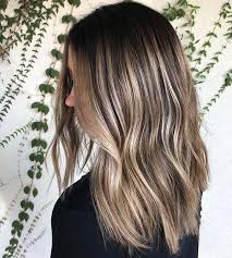 And the hair color is…brown with blonde highlights, also known as bronde. 21 Chic Examples Of Black Hair With Blonde Highlights Stayglam