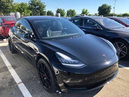 From the early prototype model the final reveal of the model 3 in full production form will take place sometime in july. Black Model 3 With Red T Badge Looks Awesome Fremont Factory Teslamotors