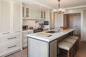 Stunning kitchen with stained maple cabinetry including a. Kitchen Cabinets Shaker Cabinets Louvered Cabinets Kitchen Remodeling The Edge Kitchen And Bath