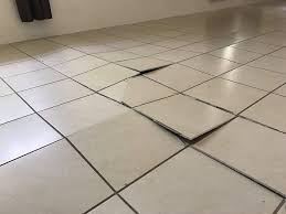 tile popping its causes how to