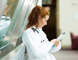 Female Doctor Reading Chart Stock Photo Siphotography