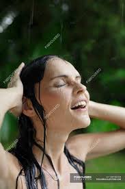 A rainfall shower head can be installed in the ceiling of the shower for a true rainfall experience. Woman In Tropical Rain Shower Raining Caucasian Ethnicity Stock Photo 139195724